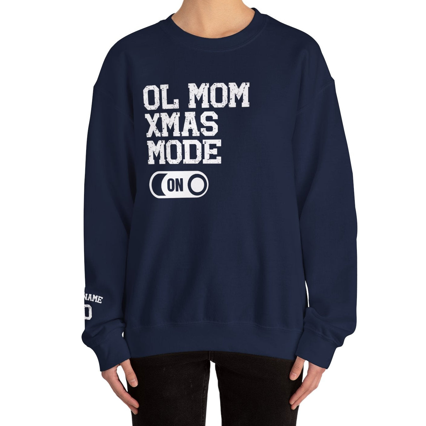 Navy blue sweatshirt with 'OL MOM XMAS MODE ON' text worn by a person on a white background