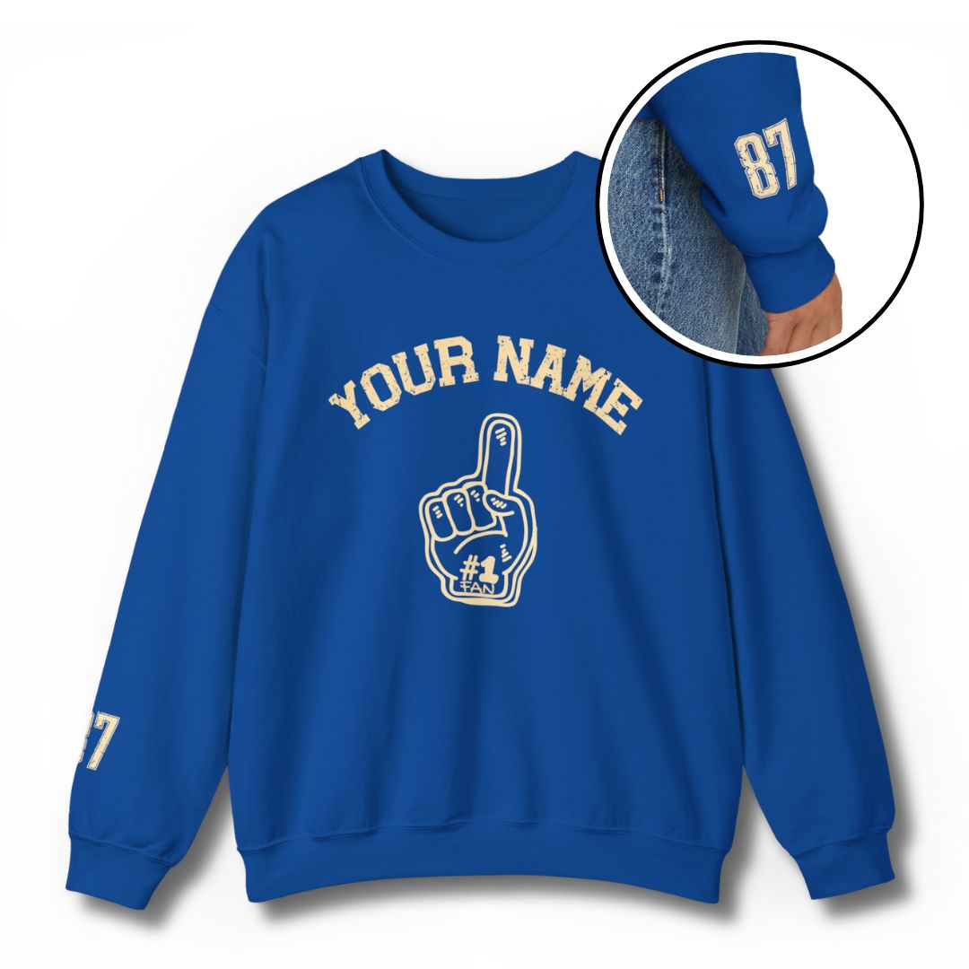Custom #1 Fan sweatshirt in royal blue with personalized YOUR NAME text and foam finger graphic, featuring player number on sleeve - perfect for sports parents and families showing pride for their young athletes