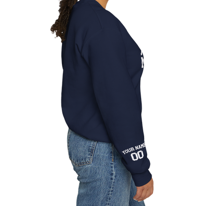Person wearing a navy sweatshirt with text on sleeves against a white background